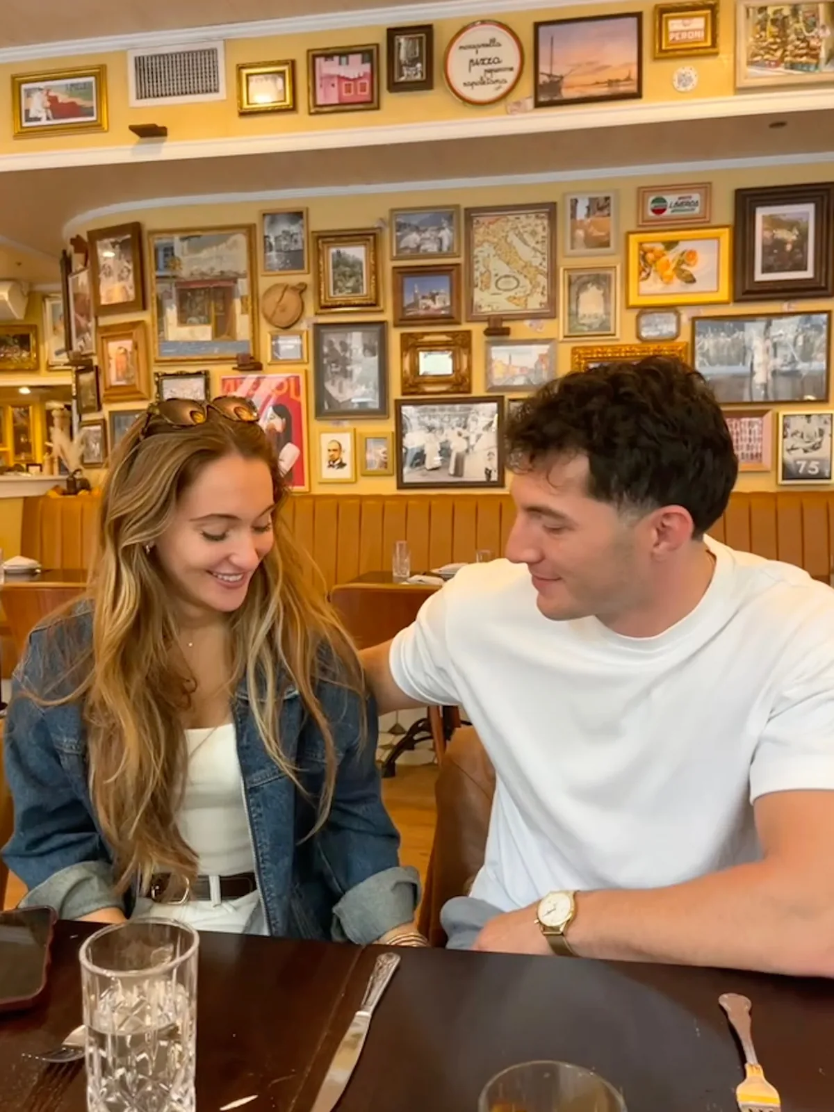 Meaghan and Roman at a restaurant booth